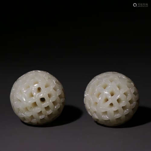 A PAIR OF WHITE JADE PIERCING ORNAMENTS