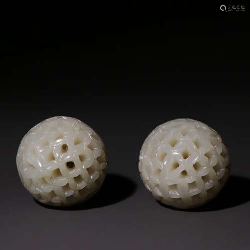 A PAIR OF WHITE JADE PIERCING ORNAMENTS