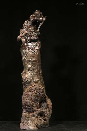 LONGYAN WOOD NATURALISTICALLY CARVED 'LUO HAN' FIGURE