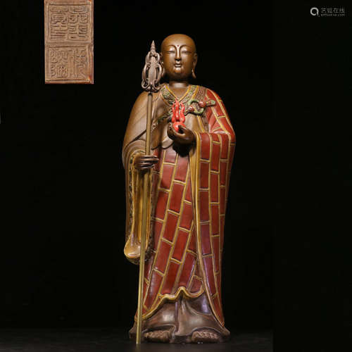 A SHIWAN KILN PORCELAIN XUANZANG STANDING STATUE