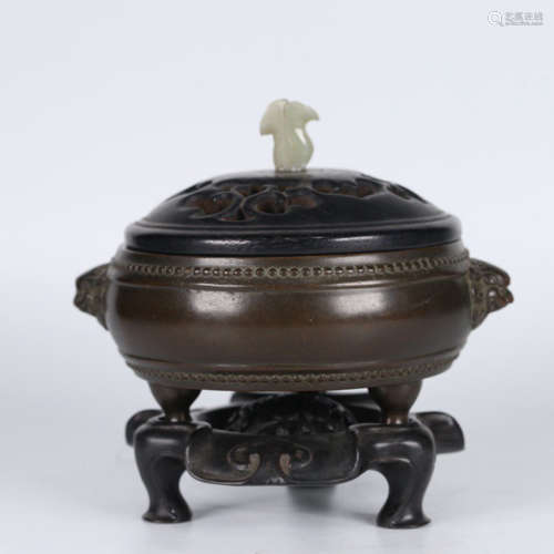 A BRONZE INCENSE BURNER WITH DOUBLE LION EARS