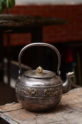 SHOWA PERIOD SILVER CAST 'TAOTIE' TEAPOT WITH HANDLE