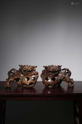 PAIR OF WOOD CARVED 'LIONS AND BALLS' FIGURES