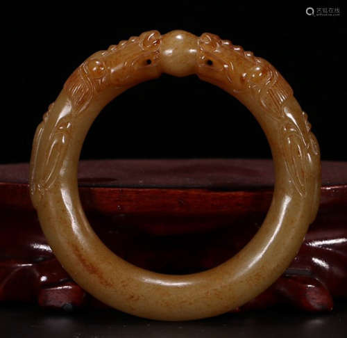 A HETIAN JADE CARVED BANGLE