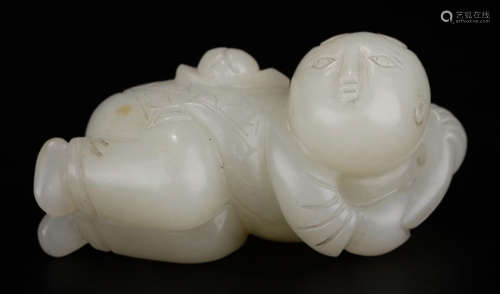 A HETIAN JADE CARVED CHILD SHAPED PENDANT