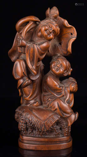 A HUANGYANG WOOD CARVED FIGURE SHAPED STATUE