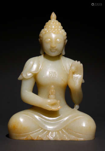 A HETIAN JADE CARVED BUDDHA STATUE