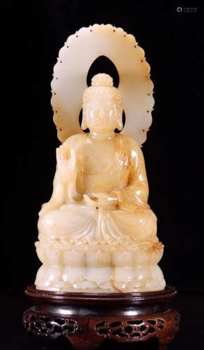 A HETIAN JADE CARVED BUDDHA SHAPED STATUE