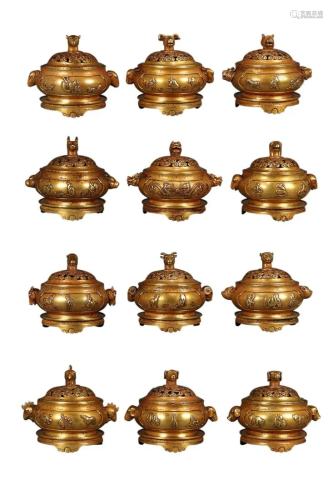 SET OF GILT COPPER ALLOY CENSERS IN THE FORM OF 12