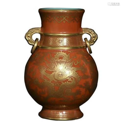 CORAL RED GLAZED GILT 'DRAGON' VASE WITH HANDLES