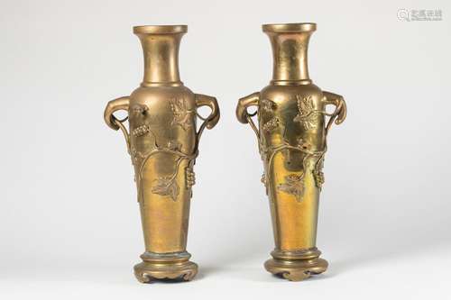 INDOCHINE Pair of bronze VASES with relief decorat…