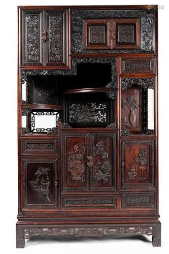 CHINA CABINET in richly carved wood decorated with…