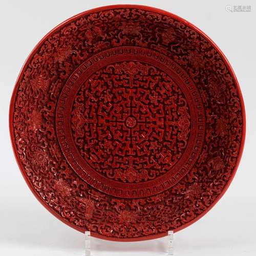 CHINA Hollow dish in sculpted cinnabar lacquer wit…