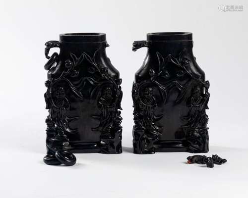 CHINA Pair of carved dark amber VASES with relief …