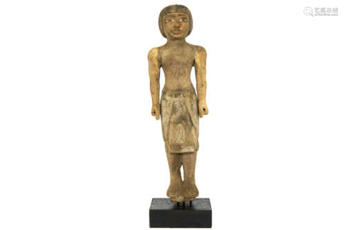 Ancient Egyptian New Kingdom period male figure sculpture in wood with remains of the [...]