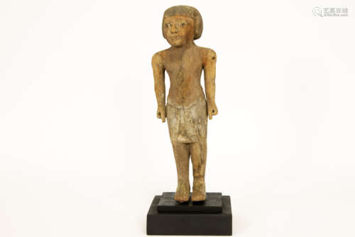 Ancient Egyptian New Kingdom period male figure sculpture in wood with remains of the [...]