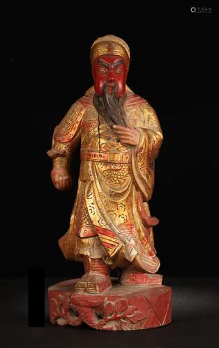 A Wood Figure Ornament With Gold Painting