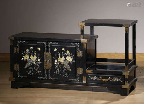 A BLACK LACQUER WITH RADEN CARVED FLOWER PATTERN CABINET