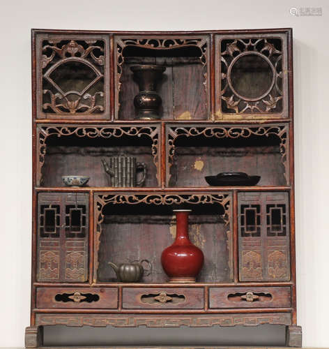 A NAN WOOD CARVED SHELF