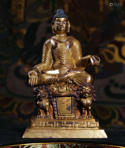 A GILT BRONZE CASTED SAKYAMUNI BUDDHA SHAPE STATUE