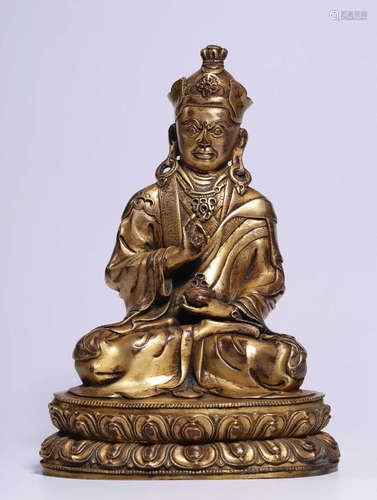 A GILT BRONZE CASTED BUDDHA SHAPE STATUE