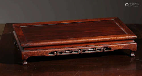 A RED WOOD CARVED DESK