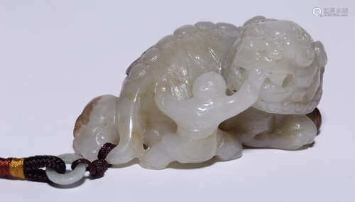 A HETIAN JADE CARVED LION SHAPE PENDANT