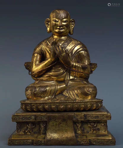 A GILT BRONZE CASTED BUDDHA SHAPE STATUE