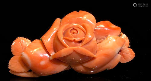 A RED CORAL CARVED FLOWER SHAPE PENDANT