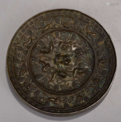 A BRONZE CASTED BEAST PATTERN MIRROR