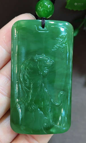 A JASPER CARVED TIGER PATTERN TABLET