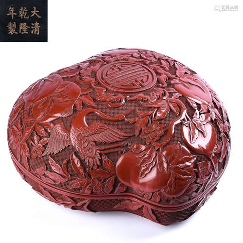 A RED LACQUER CARVED AUSPICIOUS PATTERN BOX