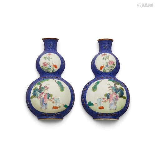 A pair of blue ground and famille rose enameled porcelain wall vases 19th/early 20th century