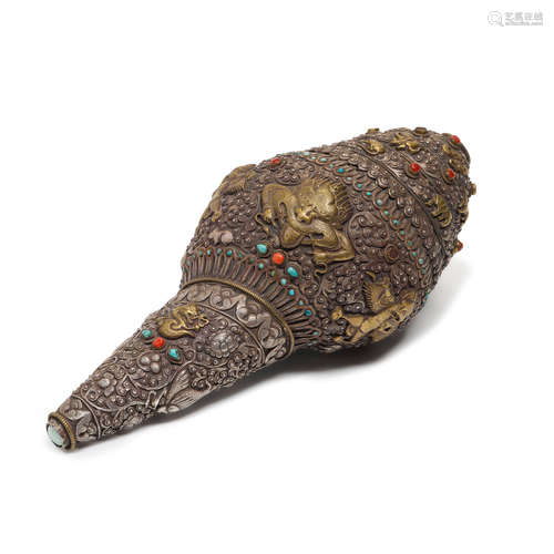 A gilt and silver metal alloy conch Tibet