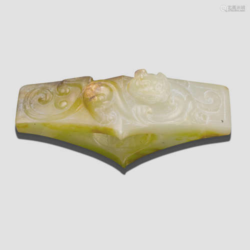 A small celadon and russet jade sword or dagger guard Han Dynasty or later