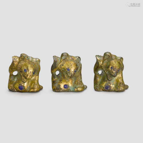 Three gilt-bronze and blue-glass-inlaid bear supports Han dynasty