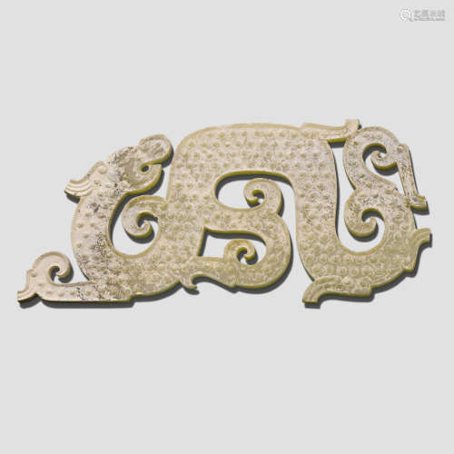 An archaistic calcified celadon jade dragon Pendant Eastern Zhou style