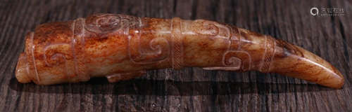 AN ANTIQUE JADE PENDANT CARVED WITH BEAST PATTERN