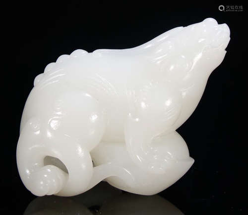 A WHITE JADE BEAST PENDANT