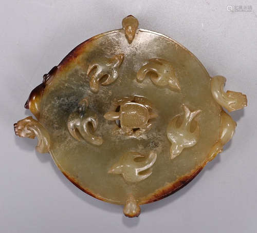 A HETIAN YELLOW JADE BI CARVED WITH BEAST