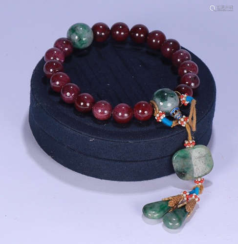 A RUBY STRING BRACELET WITH 18 BEADS