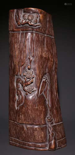 A CHENXIANG WOOD ARM REST CARVED WITH FLOWER