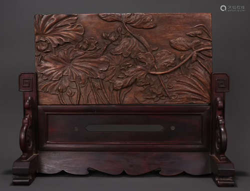 A CHENXIANG WOOD SCREEN CARVED WITH LOTUS