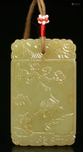 A HETIAN YELLOW JADE TABLET CARVED WITH CRANE