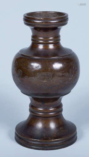 A COPPER VASE CARVED WITH STORY