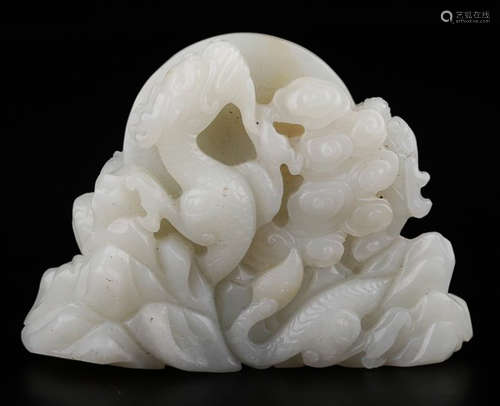 A HETIAN WHITE JADE PENDANT CARVED WITH DRAGON