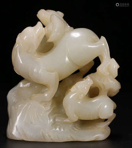 A HETIAN JADE PENDANT CARVED WITH BEAST