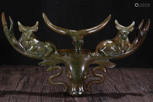 AN ANTIQUE JADE PENDANT CARVED WITH BEAST