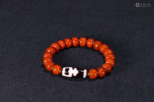 An Amber Bracelet With Dzi