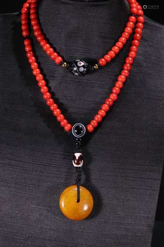 A Tibetan Amber Colored Glaze Necklace